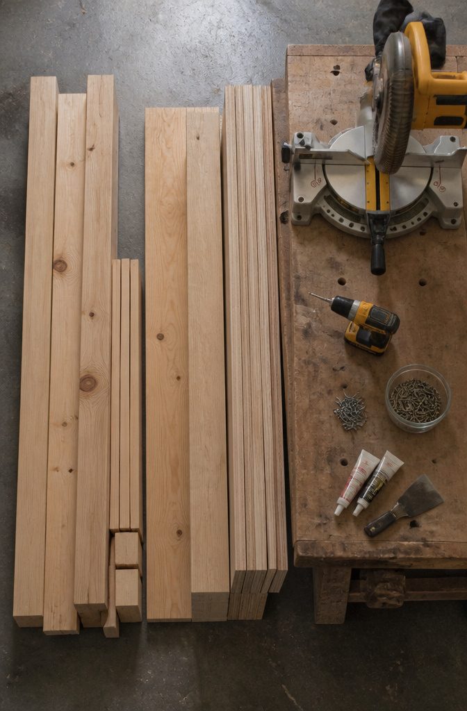 Materials and tools laid out for constructing bunk bed stairs.