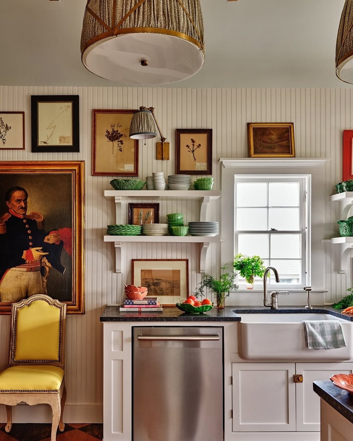 A rustic kitchen with white beadboard walls, open shelving, and a large portrait painting.