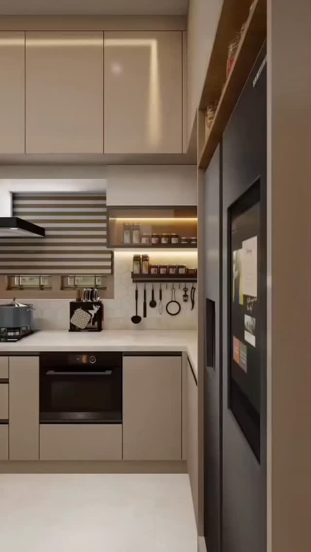 Beige minimalist kitchen cabinets extending to the ceiling with integrated lighting and a white countertop.